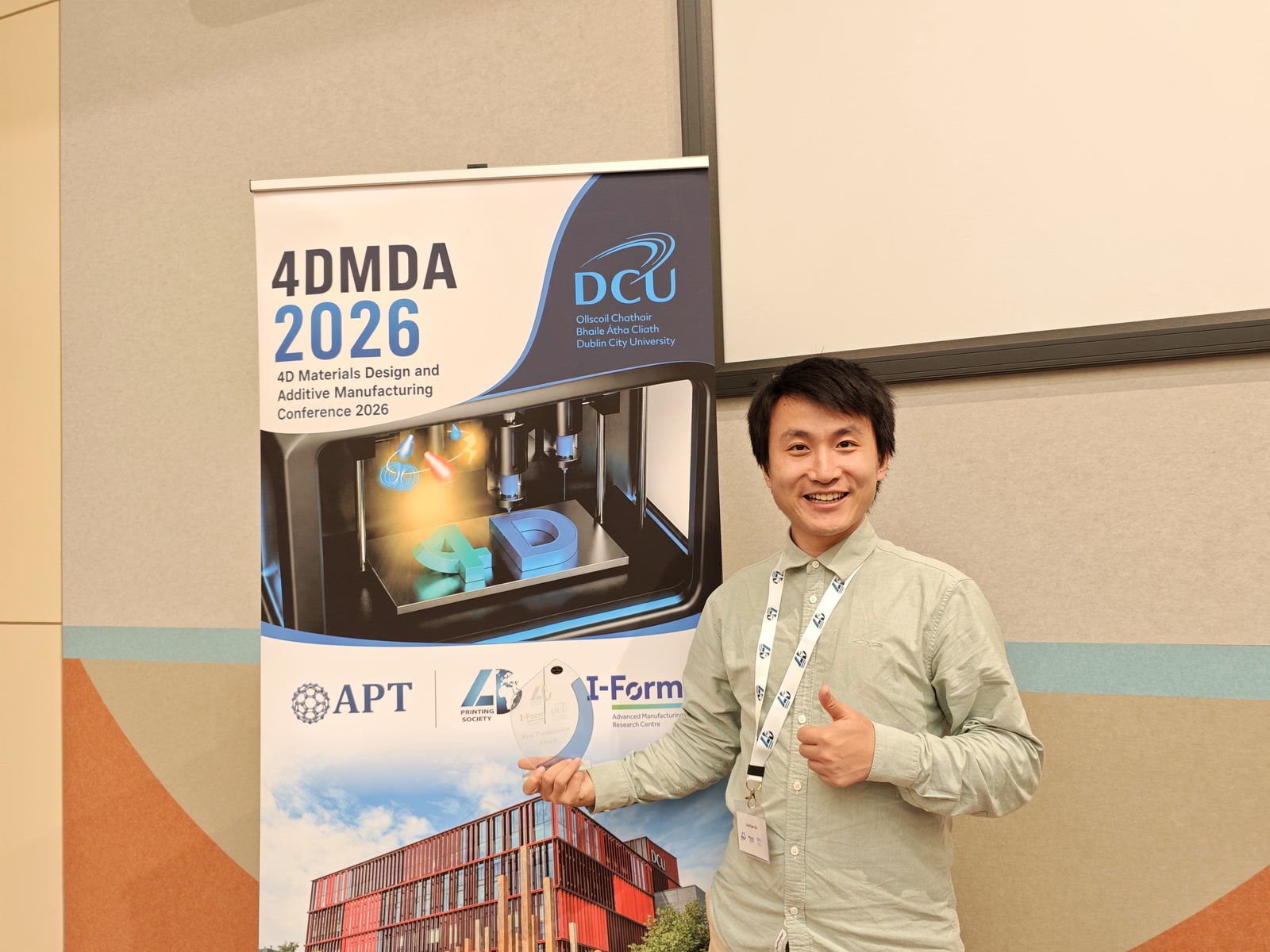 Liuchao Jin holding the Best Presentation Award in front of the 4DMDA 2026 conference banner in Dublin
